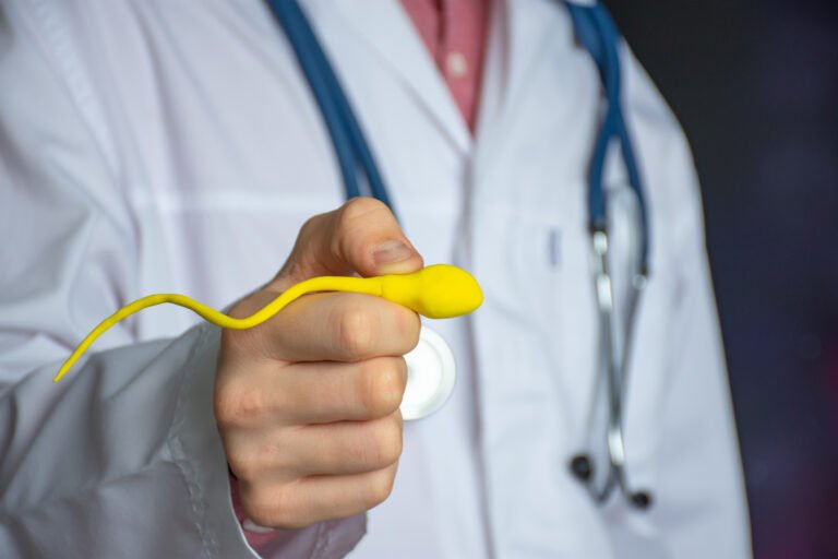 Fertility specialist holding a sperm model to illustrate male fertility and sperm health.